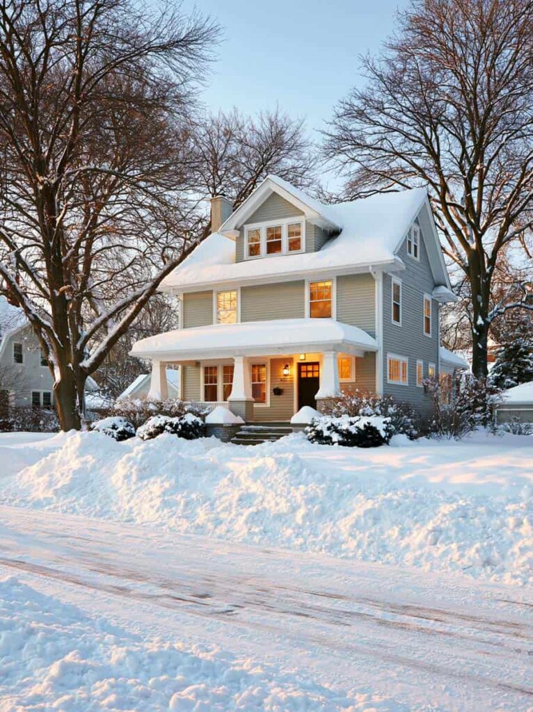 classic two-story American Foursquare home in a Cleveland neighborhood on a bright winter morning